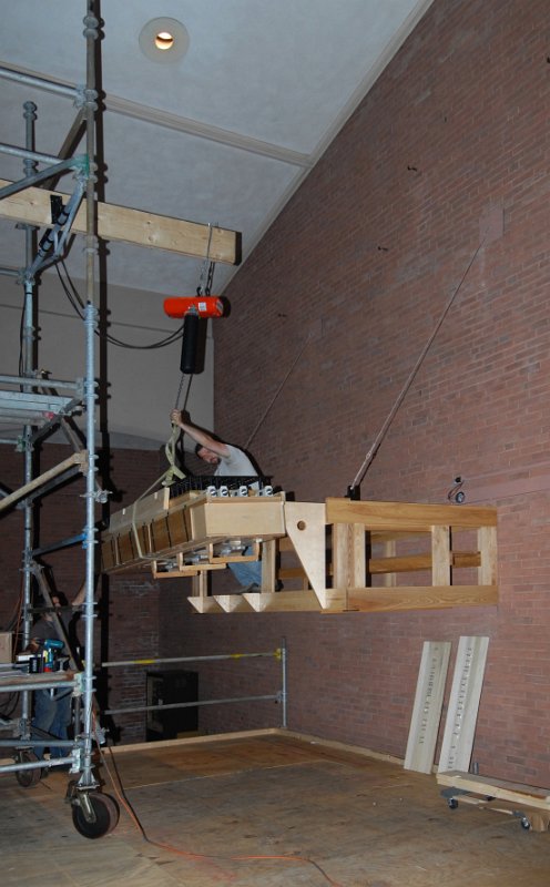 DSC_4699.JPG - Hoisting the main wind chest into the west antiphonal framing.