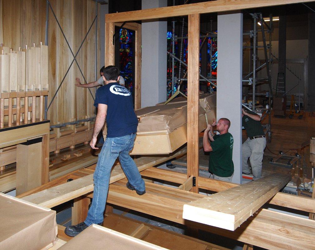 DSC_5386.JPG - Hoisting the next wind chest up into the pulpit-side expression chamber.