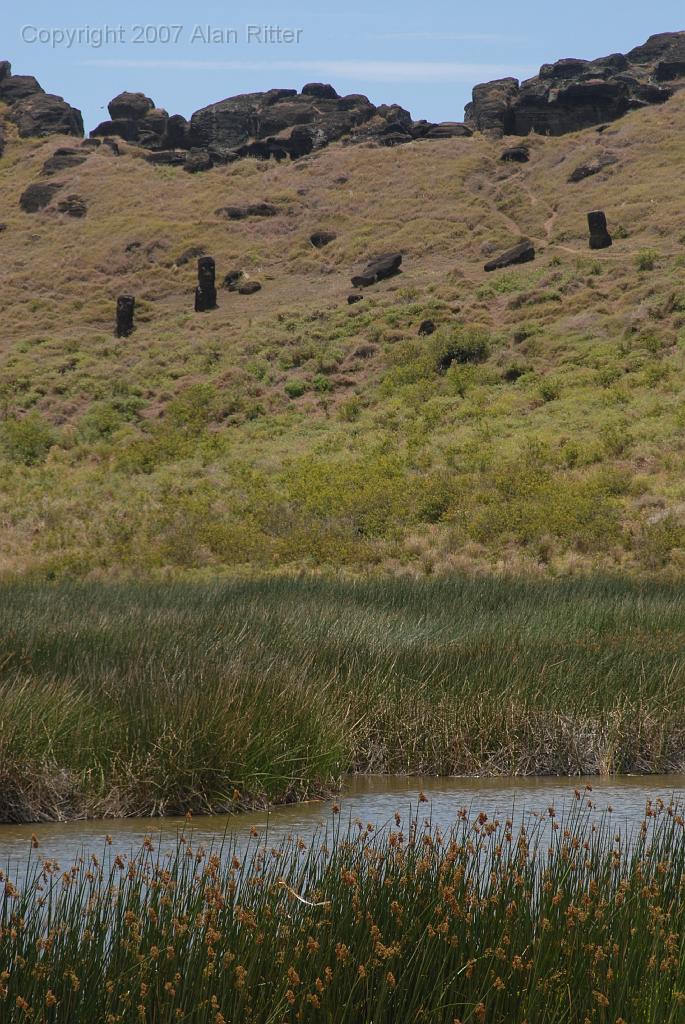 Slide_122.jpg - View across the Lagoon in the Crater, with Moai on the Slope in the Background